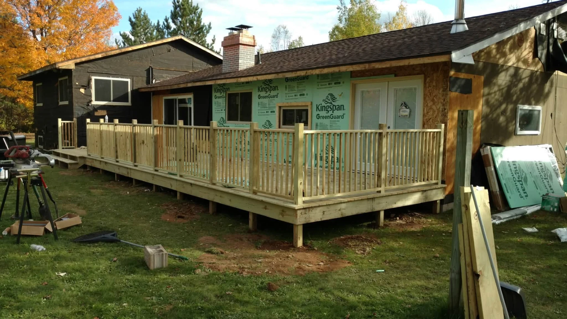 Deck framing and railings installed during exterior remodel