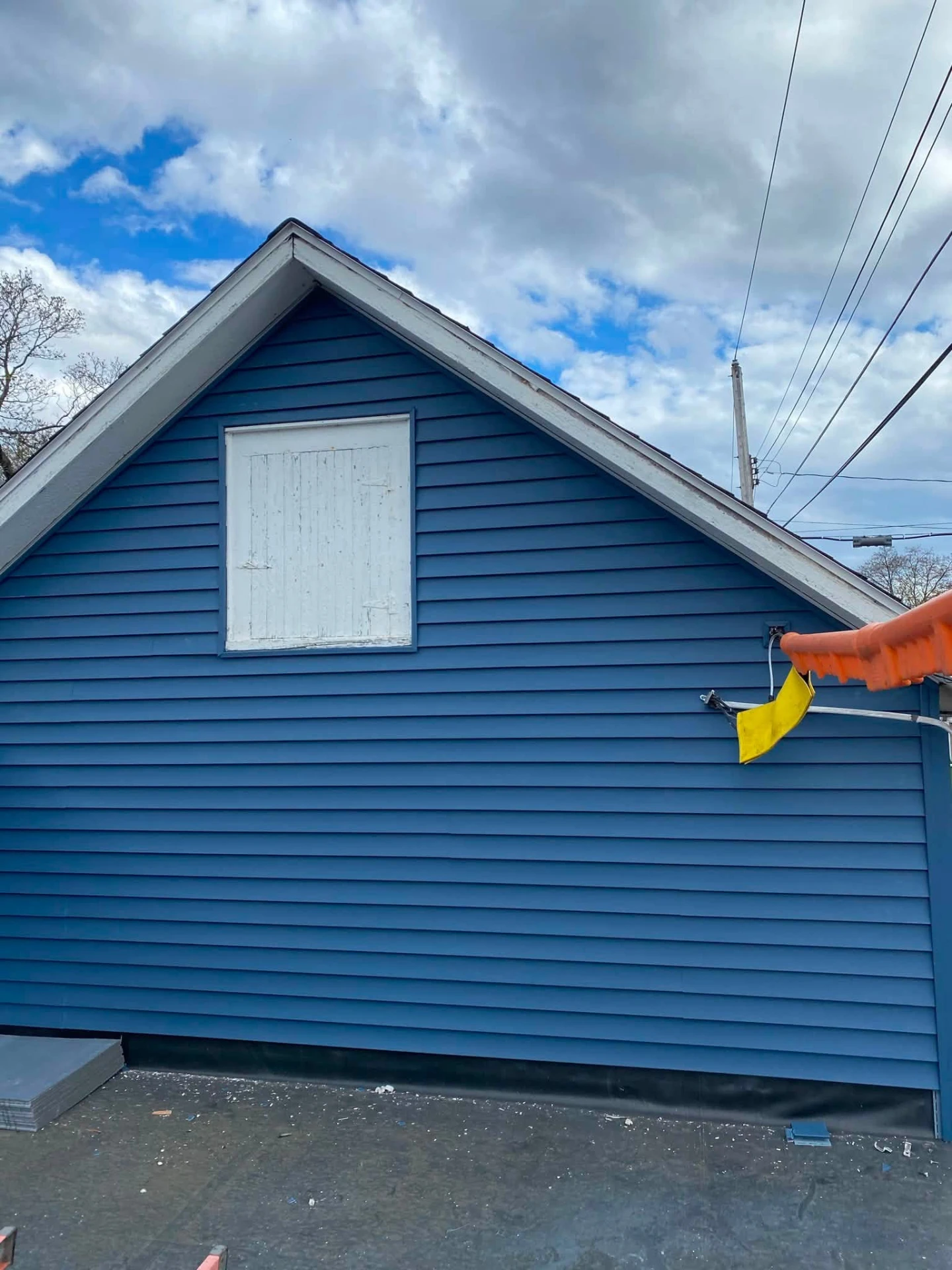 Fresh blue siding and gable end on a residential home